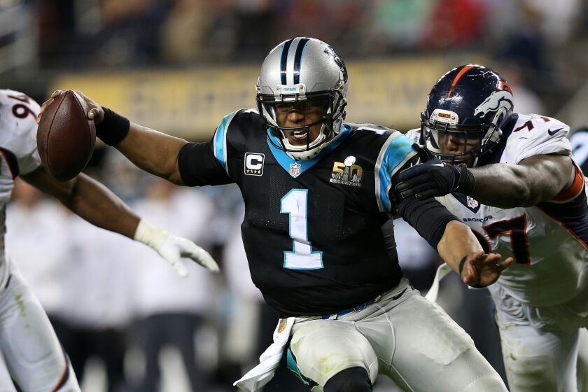 Panthers quarterback Cam Newton (1) is brought down by Broncos defensive end Malik Jackson during the fourth quarter.