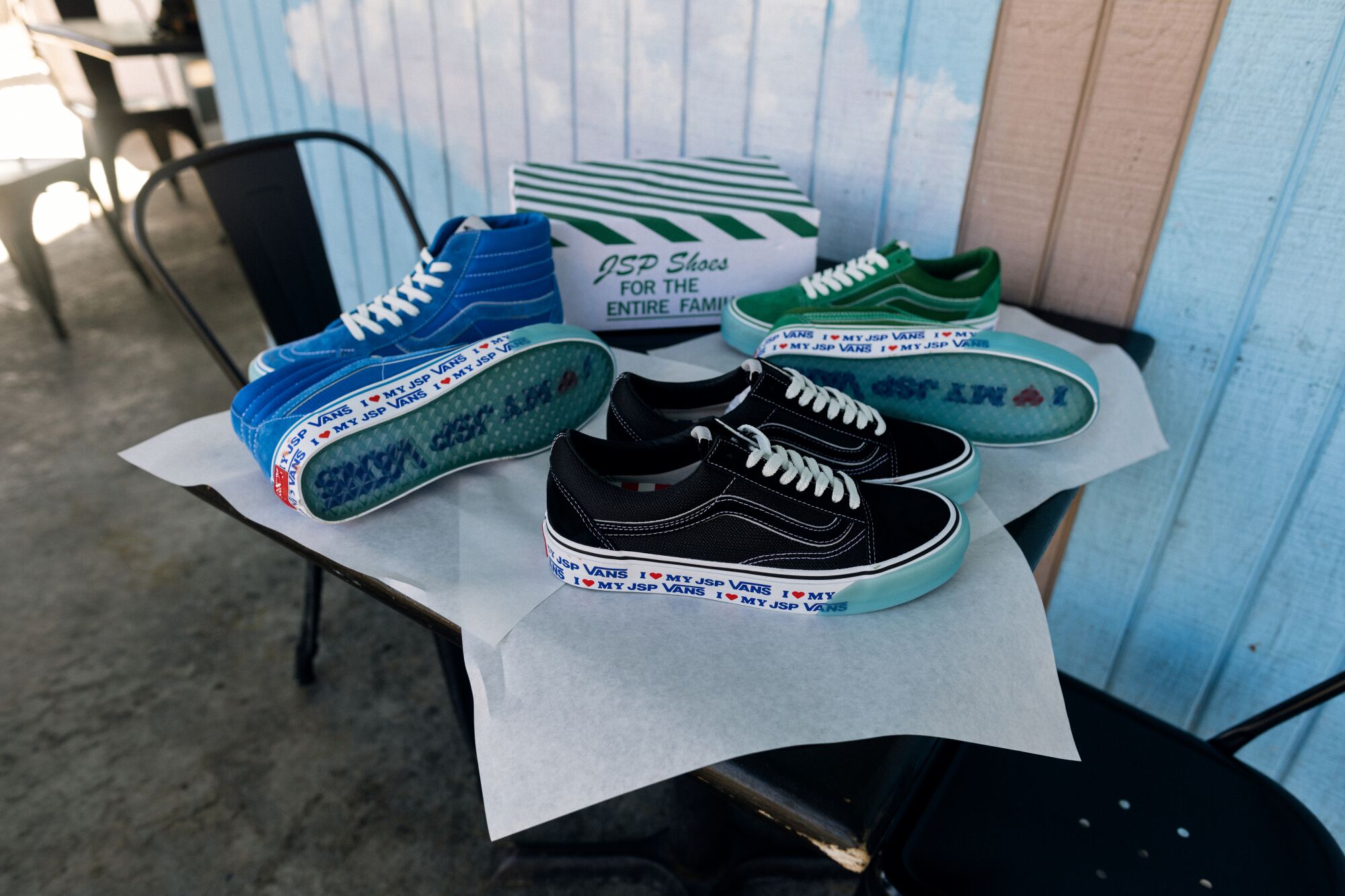 An assortment of sneakers on a table top.