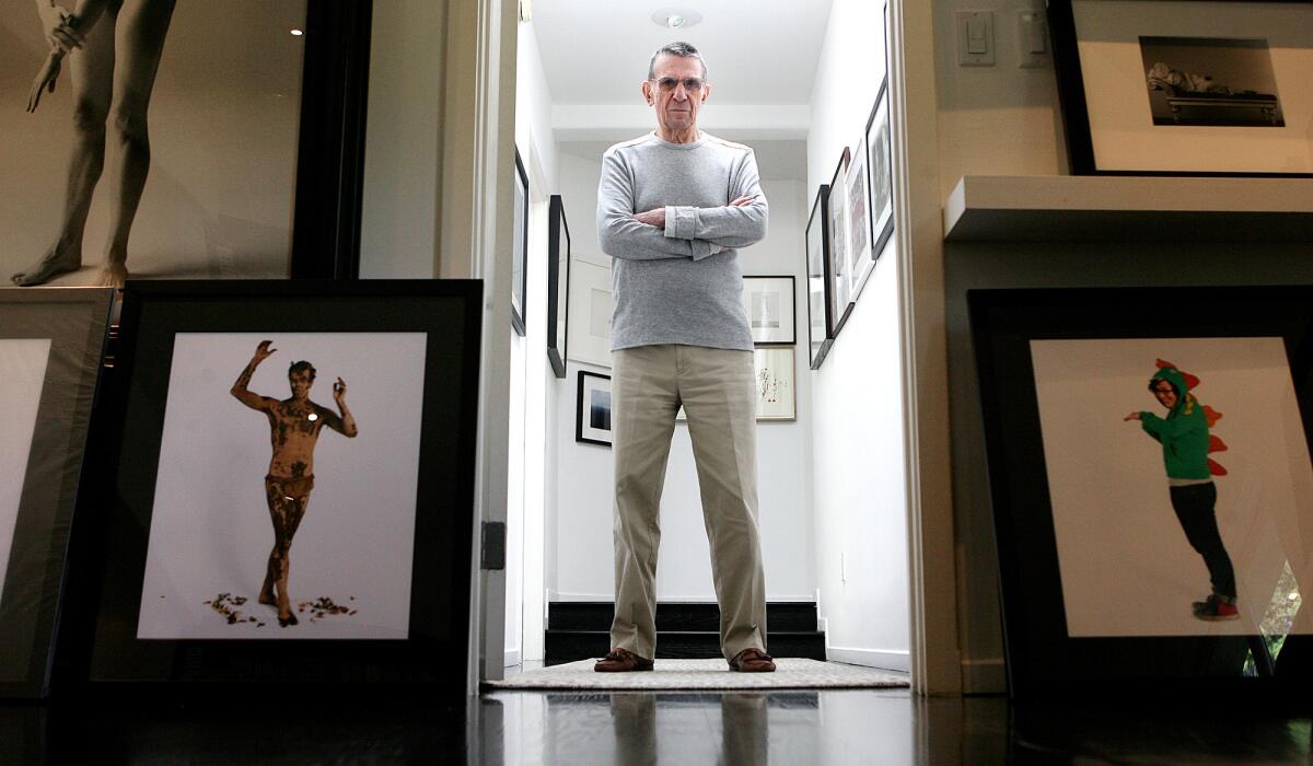 Leonard Nimoy at home in 2009, with images from his "Who Do You Think You Are?" in the foreground.