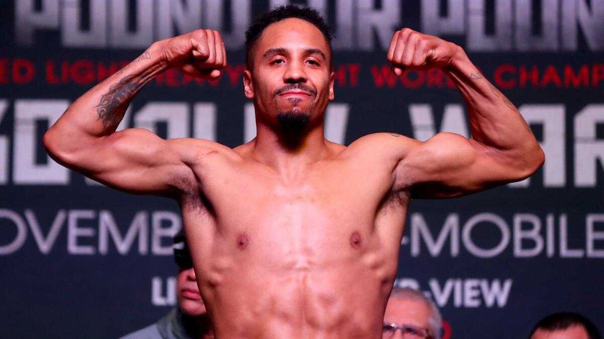 Andre Ward poses on the scale Friday during the official weigh-in for his fight against Sergey Kovalev.