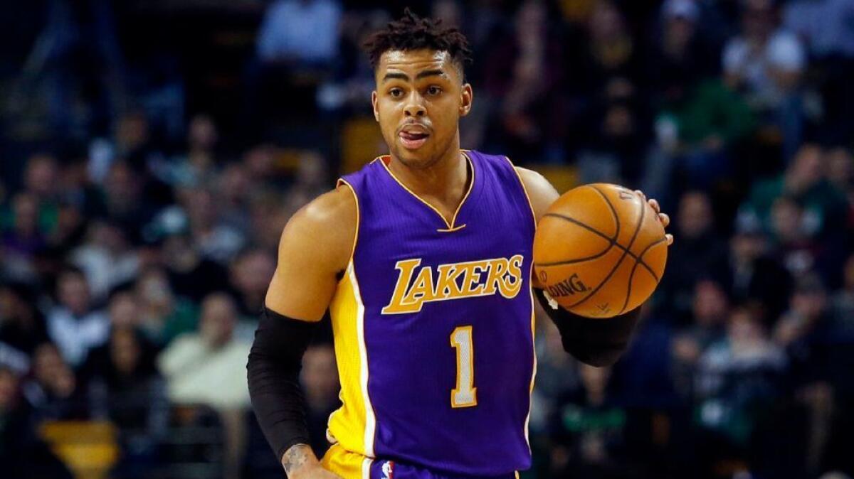 Lakers guard D'Angelo Russell dribbles the ball during the second half of a game against the Celtis on Feb. 3.