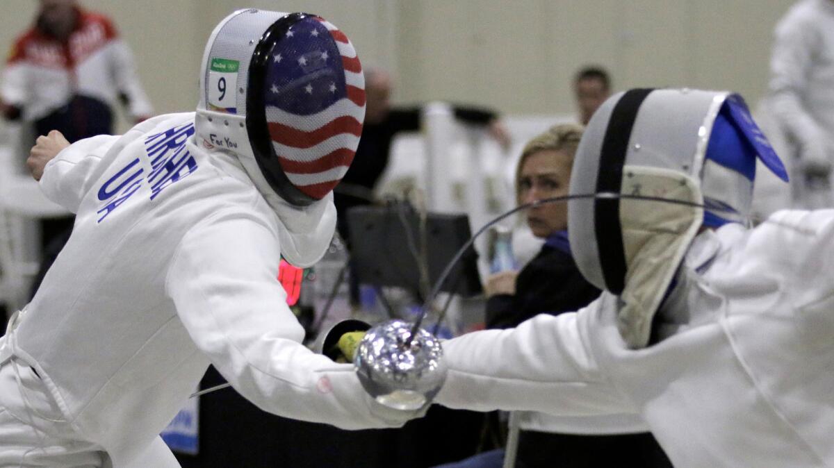 Nathan Schrimsher, a top U.S. pentathlete, competes in fencing during the Modern Pentathlon World Cup at the Pomona Fairplex. The modern pentathlon comprises five events -- swimming, fencing, cross-country running, shooting and show jumping.