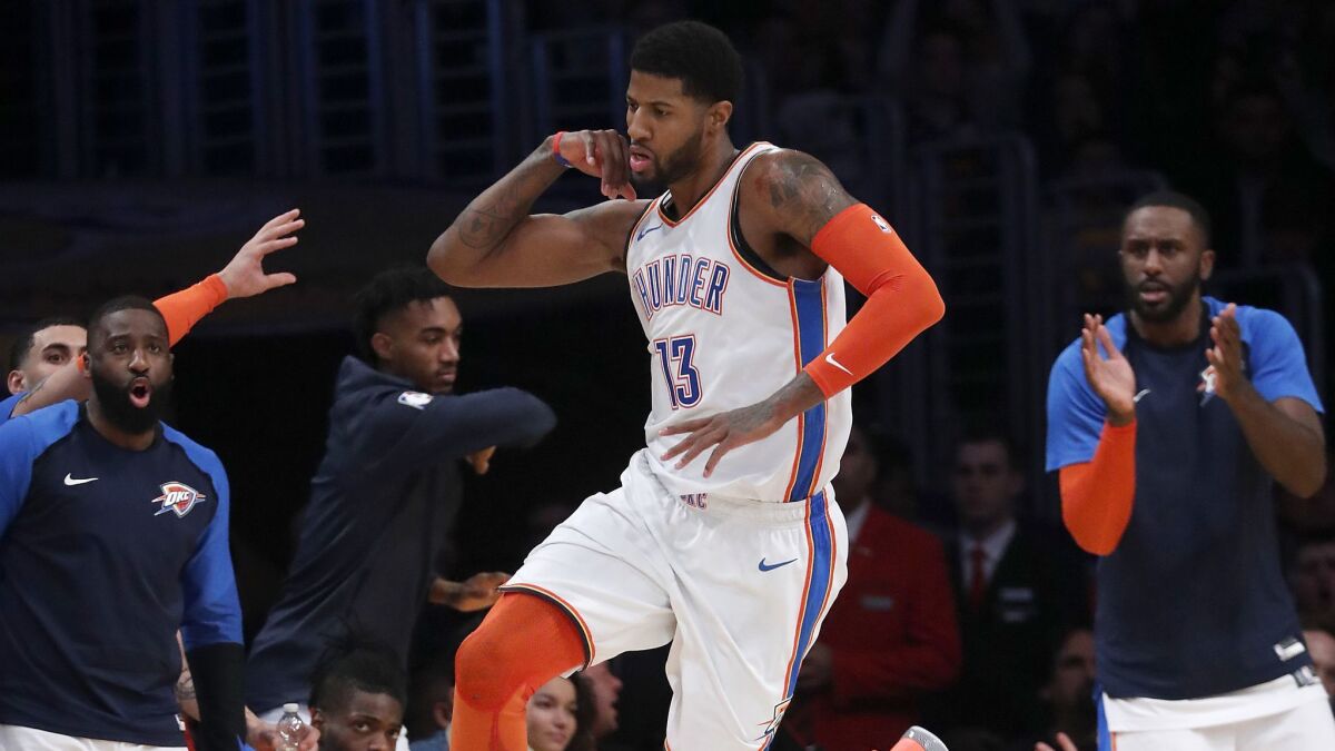 Thunder forward Paul George celebrates after scoring a basket against the Lakers in the second quarter.