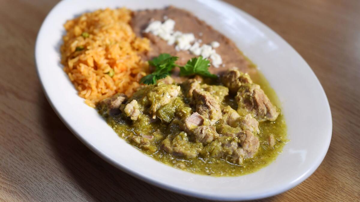 Chile verde is served with rice and beans, at Zapien's Salsa Grill and Taqueria in Pico Rivera. (Christina House / For The Times)
