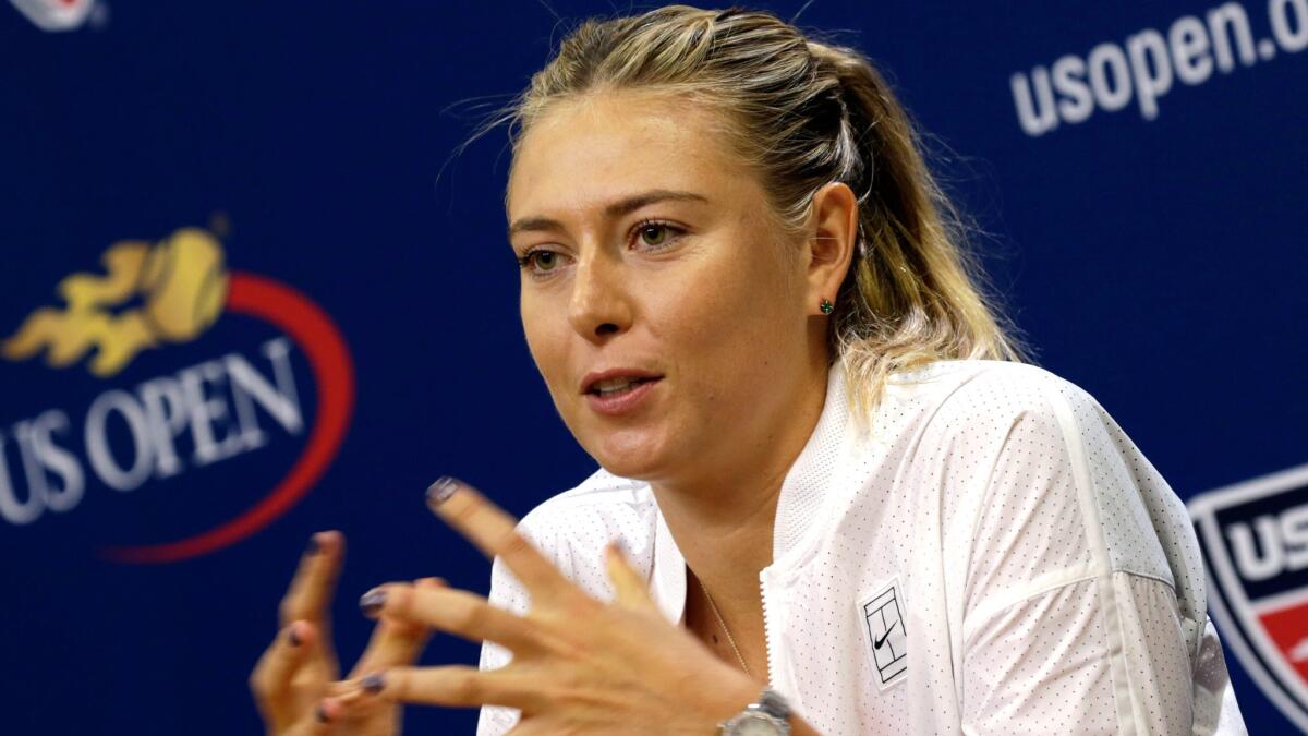 Maria Sharapova talks to reporters during a news conference in New York on Saturday.