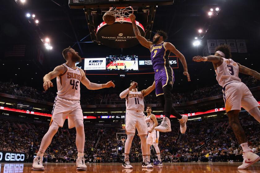 PHOENIX, ARIZONA - NOVEMBER 12: JaVale McGee #7 of the Los Angeles Lakers slam dunks the ball over Aron Baynes #46 of the Phoenix Suns during the second half of the NBA game at Talking Stick Resort Arena on November 12, 2019 in Phoenix, Arizona. The Lakers defeated the Suns 123-115. NOTE TO USER: User expressly acknowledges and agrees that, by downloading and/or using this photograph, user is consenting to the terms and conditions of the Getty Images License Agreement (Photo by Christian Petersen/Getty Images) ** OUTS - ELSENT, FPG, CM - OUTS * NM, PH, VA if sourced by CT, LA or MoD **