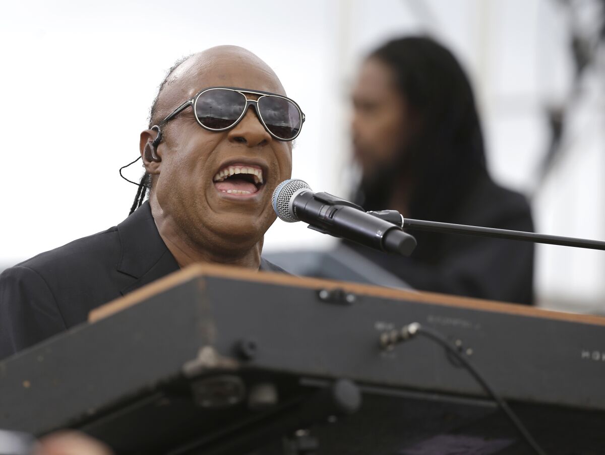 FILE - In this Sunday, Nov. 6, 2016 file photo, Musician Stevie Wonder performs at a campaign rally for Democratic presidential candidate Hillary Clinton before President Barack Obama spoke to the audience in Kissimmee, Fla. Stevie Wonder will headline Global Citizen Live’s star-studded 24-hour event in Los Angeles this month to help raise money and make a plea for increased COVID-19 vaccine doses along with bringing awareness toward climate change and poverty. Global Citizen officials announced Thursday, Sept. 9, 2021 that Wonder will be among several performers – including H.E.R., Adam Lambart and Demi Lovato – to take part in the event at The Greek Theatre on Sept. 25. (AP Photo/John Raoux, File)
