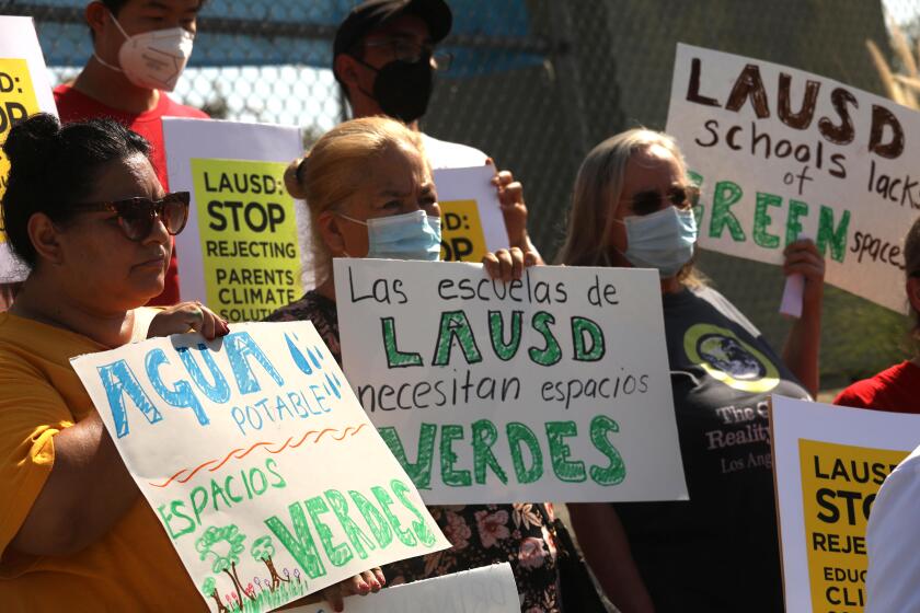 BOYLE HEIGHTS, CA - SEPTEMBER 7, 2022 - - Parents and community groups demand LAUSD address sweltering school conditions during an historic heatwave and call out Superintendent Carvalho and LAUSD for rejecting comprehensive climate justice proposals during a press conference outside the Lorena Street Elementary School in the Boyle Heights in Los Angeles on September 7, 2022. Alliance of Californians for Community Empowerment (ACCE), Los Angeles Alliance for a New Economy (LAANE), Students Deserve, Reclaim Our Schools Los Angeles, United Teachers Los Angeles (UTLA), Angelenos for Green Schools and Climate Reality Project LA participated in the presser. (Genaro Molina / Los Angeles Times)
