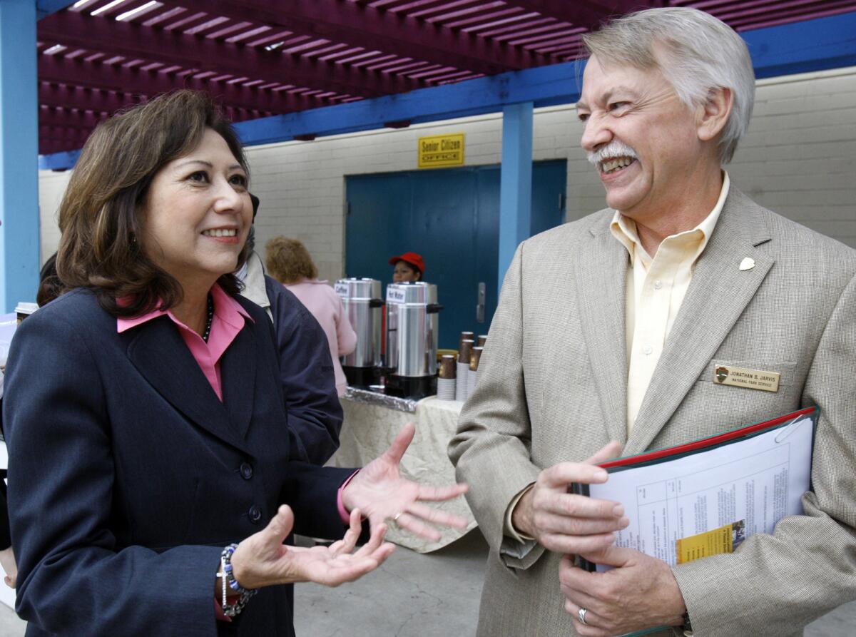 Former Labor Secretary Hilda Solis talks with National Park Service Director Jonathan Jarvis in Los Angeles in 2013. Solis has endorsed Colton attorney Eloise Gomez Reyes in the 31st Congressional District race.