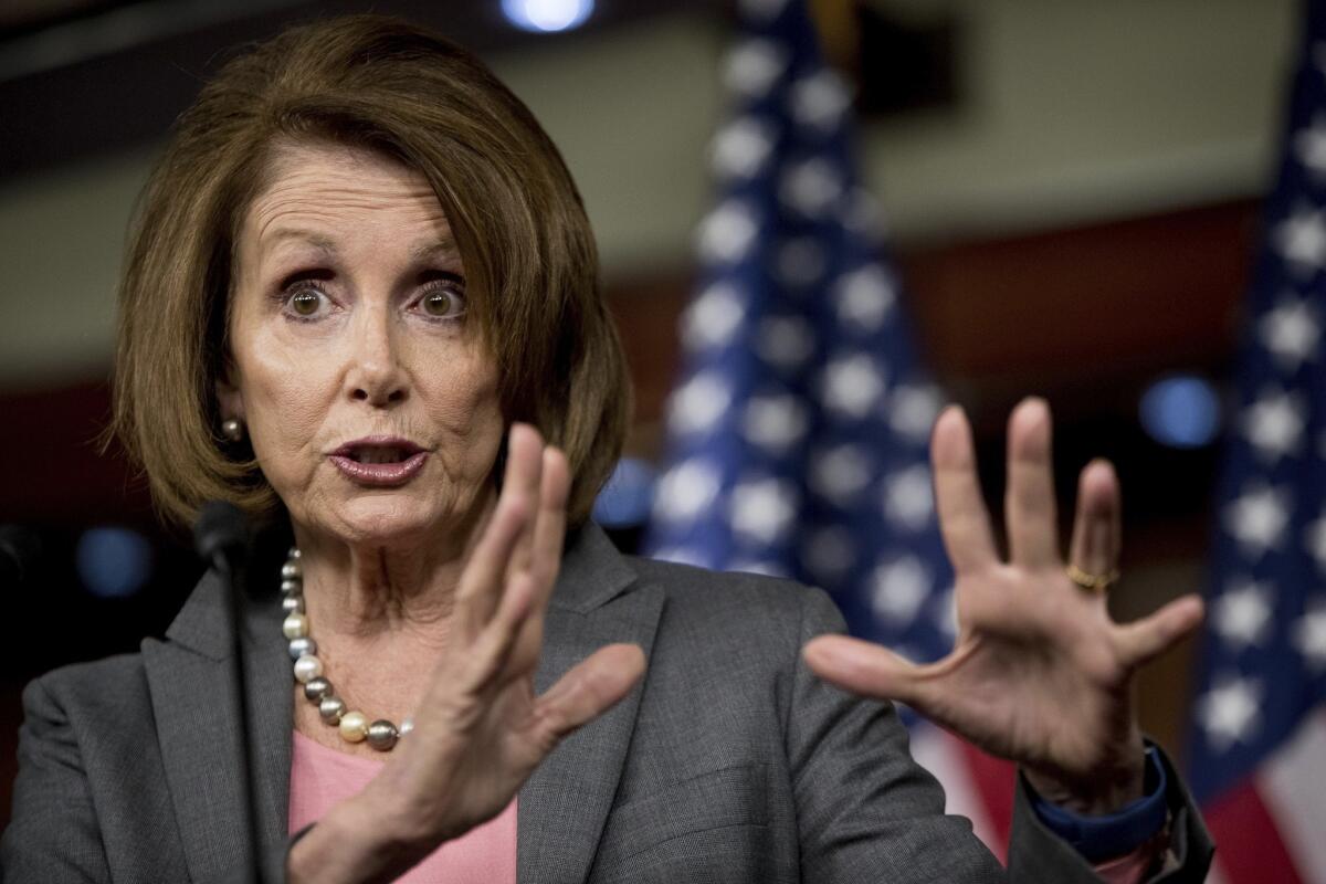 Nancy Pelosi gestures while talking. 