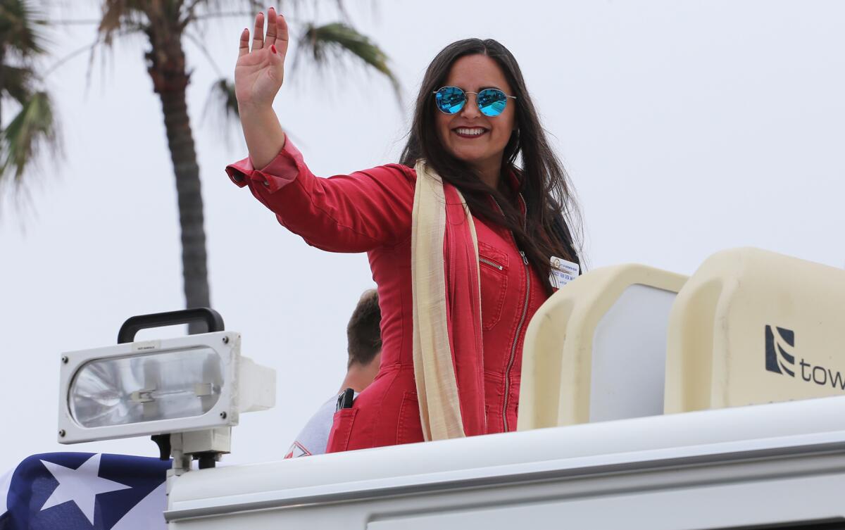 Huntington Beach Mayor Gracey Van Der Mark waves during parade.