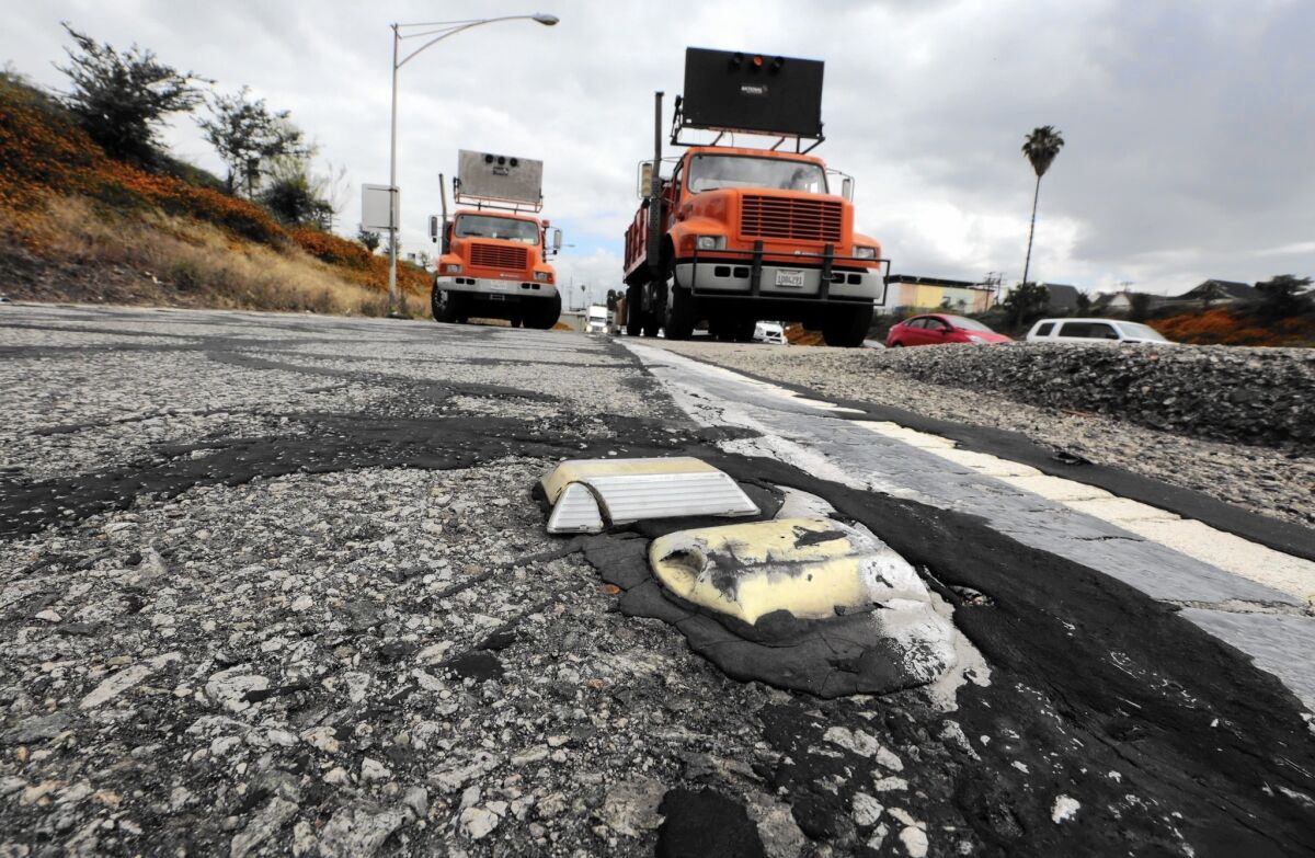 Officials estimate it will cost $59 billion to fix the state's now-crumbling roads and freeways. Above, the Main Street offramp from the southbound 5 Freeway is repaired this month in downtown Los Angeles .