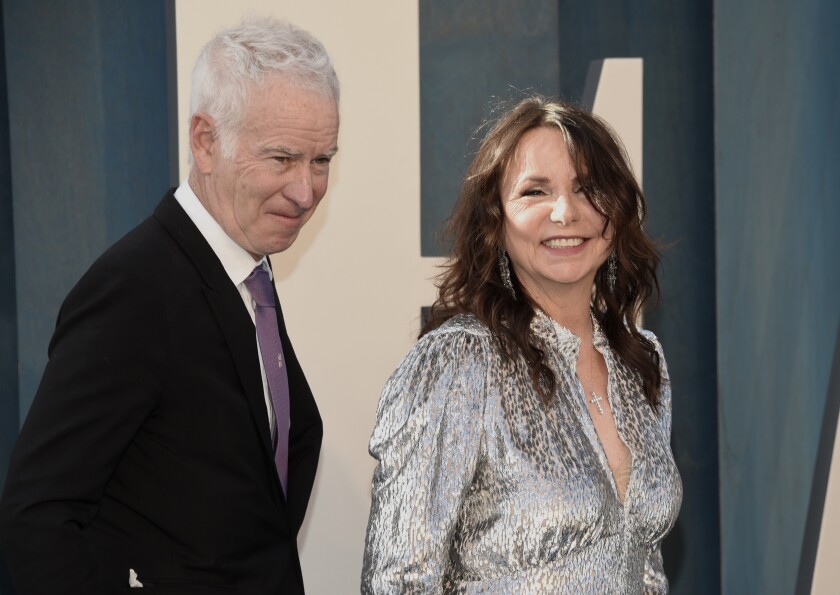 John McEnroe, left, and Patty Smyth arrive at the Vanity Fair Oscar Party on Sunday, March 27, 2022