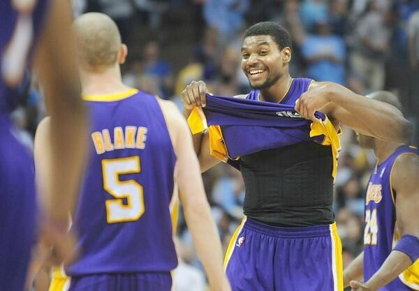 Lakers center Andrew Bynum begins to celebrate with guard Steve Blake after their 92-88 victory over the Nuggets in Game 4 of their first-round playoff series on Sunday night in Denver.