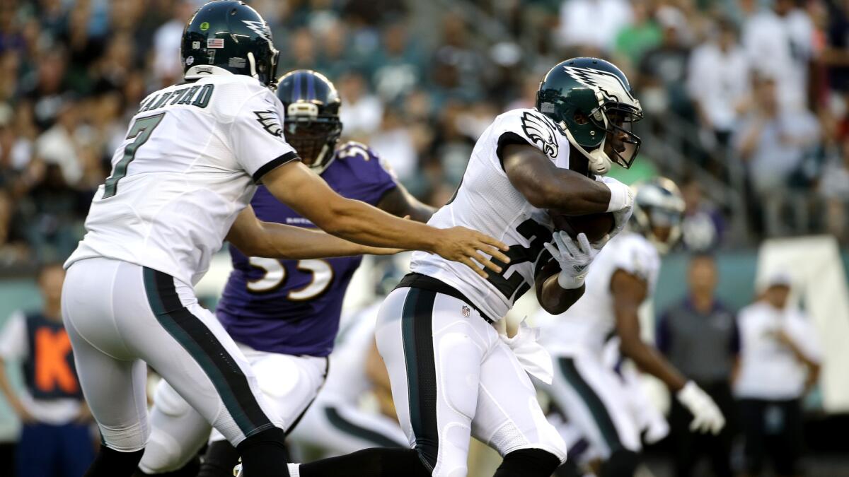 Eagles quarterback Sam Bradford hands off to running back DeMarco Murray during the first half of a preseason game against the Ravens on Saturday in Baltimore.