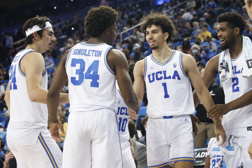 UCLA guards Jules Bernard (1), Jaime Jaquez Jr. (24), David Singleton (34) and forward Cody Riley (2)in the second half of an NCAA college basketball exhibition game against the Chico State Thursday, Nov. 4, 2021, in Los Angeles. (AP Photo/Ringo H.W. Chiu)