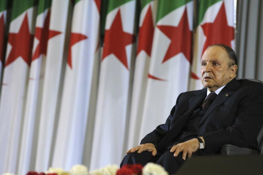 FILE - In this April 28, 2014 file photo, Algerian President Abdelaziz Bouteflika sits in a wheelchair after taking oath as President, in Algiers. Algeria's powerful army chief said Tuesday March 26, 2019 that he wants to trigger the constitutional process that would declare President Abdelaziz Bouteflika unfit for office, after more than a month of mass protests against the ailing leader's long rule. (AP Photo/Sidali Djarboub, File)