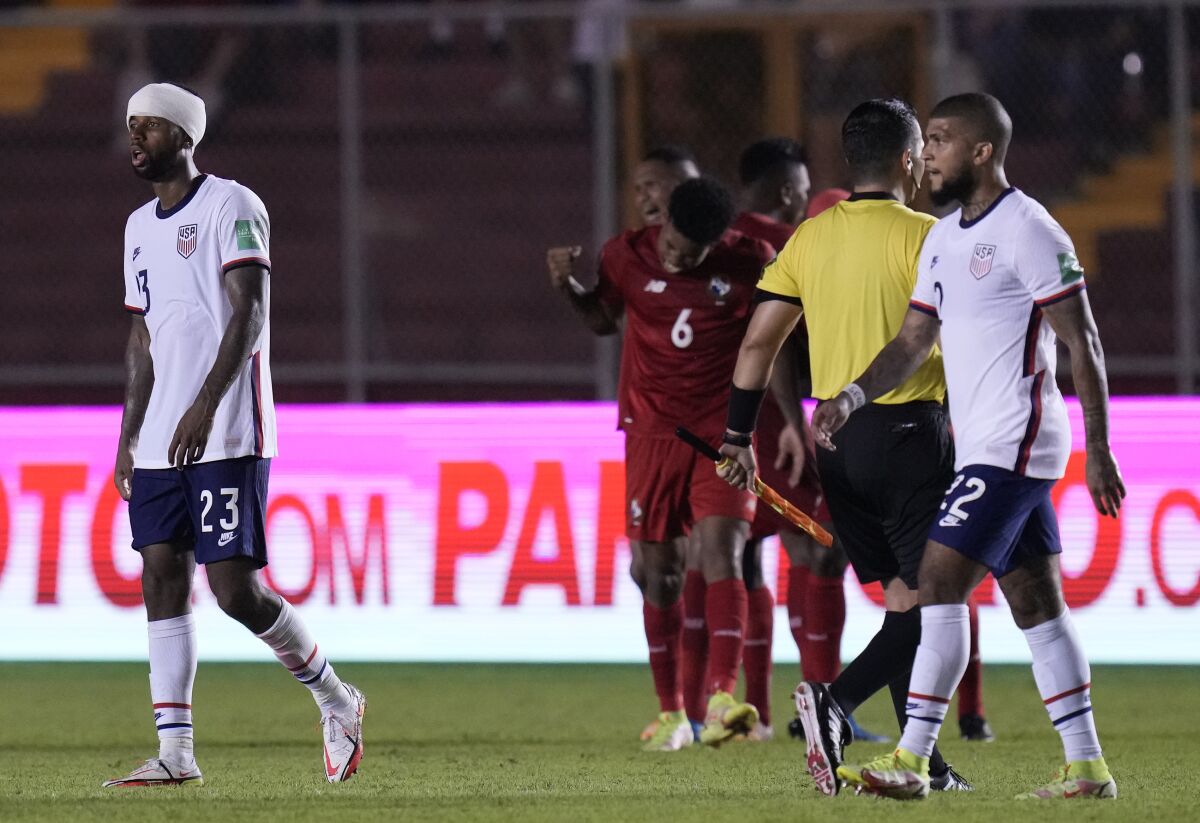 U.S. players leave the field after losing to Panama on Sunday.