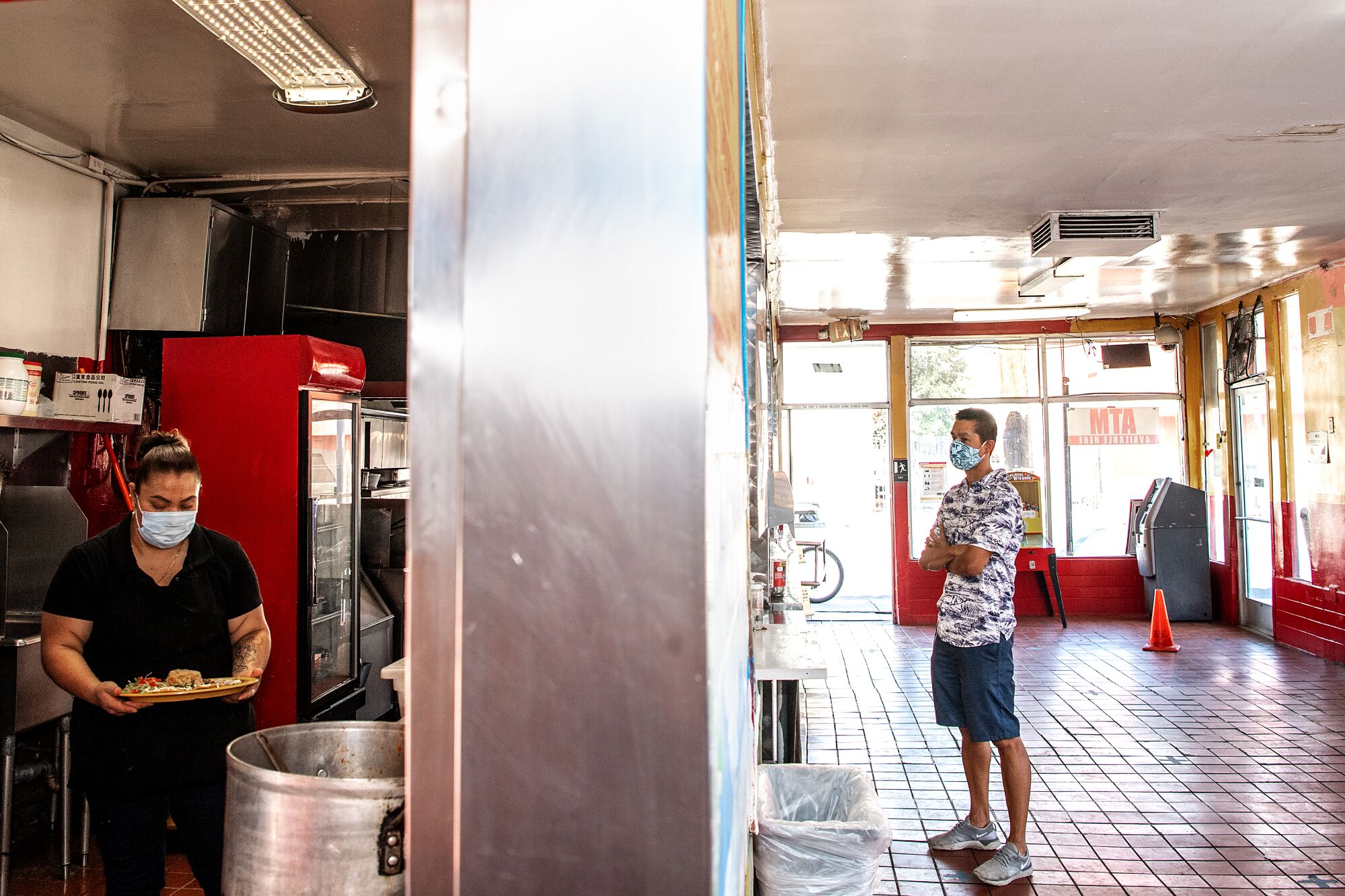 A customer waits to order inside El Gran Burrito.