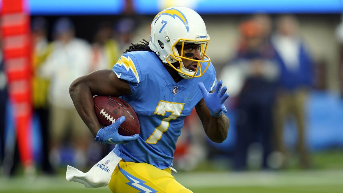 Los Angeles Chargers wide receiver Andre Roberts runs for a touchdown on a kick return.