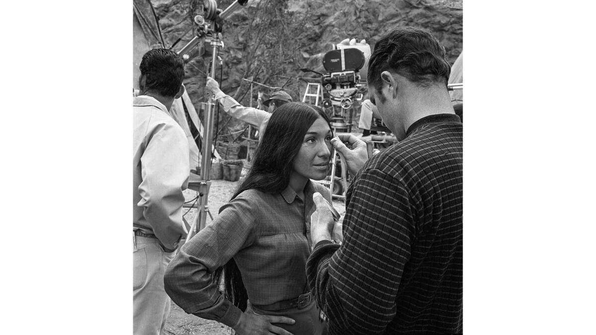 April 1968: Indian folk singer Buffy Sainte-Marie has makeup applied for an outdoor scene of TV's "The Virginian" at Universal Studios.