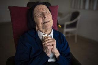 Sister Andre poses for a portrait at the Sainte Catherine Laboure care home in Toulon, southern France, Wednesday, April 27, 2022. The French nun who was believed to be the world's oldest person died at 118 in her sleep early Tuesday Jan.17, 2023, the spokesperson for her nursing home in Toulon, David Tavella, said Wednesday. (AP Photo/Daniel Cole, File)