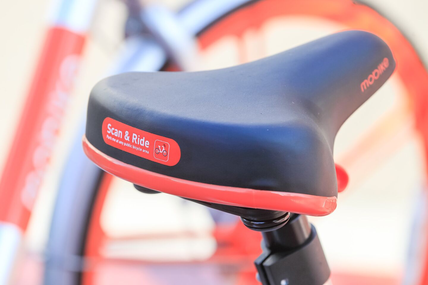 This is Mobike with a sign on the seat.