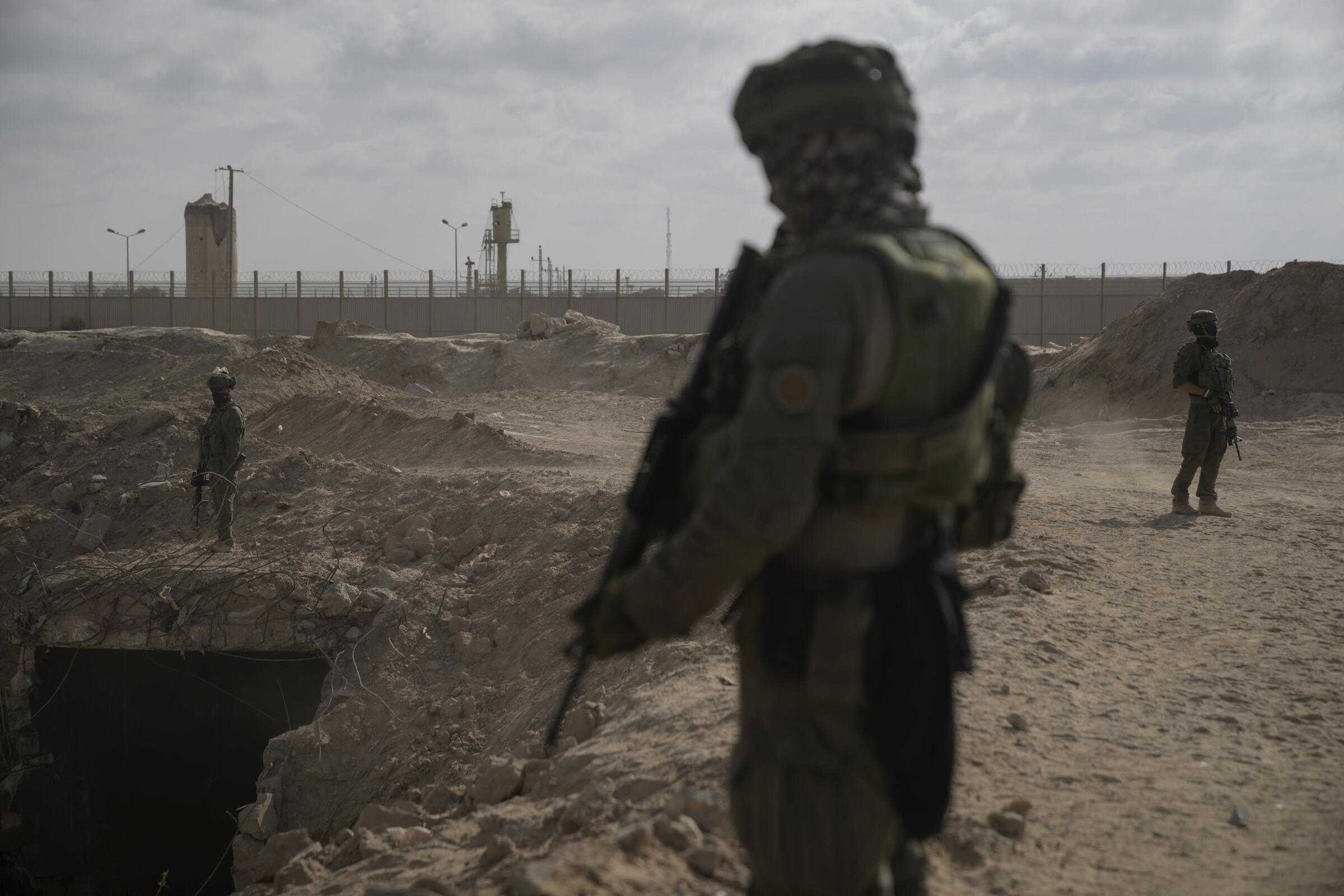 Israeli soldiers take up positions.