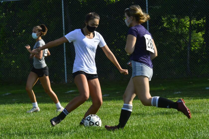 Members of the Brattleboro, Vt., Union High School’s girls’ varsity soccer team practice the season in 2020.
