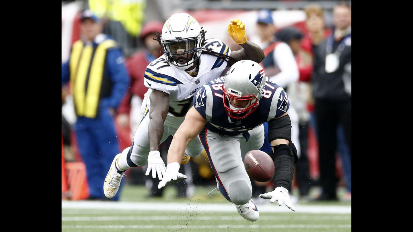 Patriots tight end Rob Gronkowski is unable to make the catch as the Chargers' Jahleel Addae defends during the first half