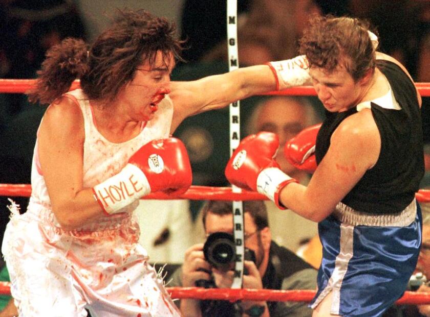 Christy Martin, left, fights Andrea DeShong
