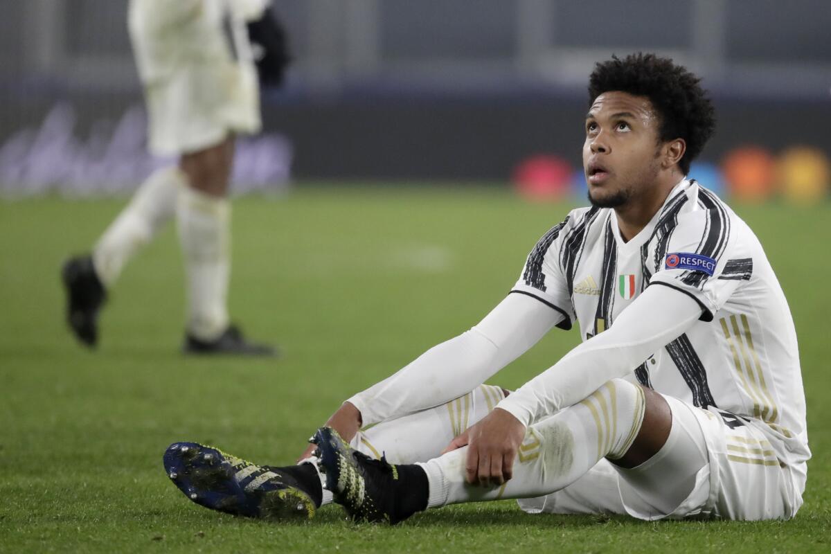 Juventus' Weston McKennie sits on the pitch at the end of the Champions League, round of 16, second leg, soccer match between Juventus and Porto in Turin, Italy, Tuesday, March 9, 2021. Juventus won 3-2 but Porto advances on a 4-4 aggregate result. (AP Photo/Luca Bruno)