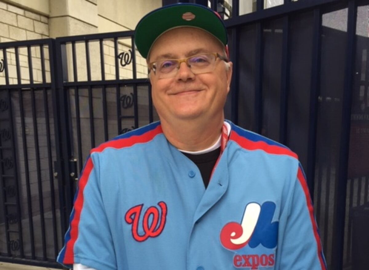 Washington Nationals fan Lyle Green wears his Nationals/Montreal Expos tribute jersey to Game 3 of the National League Division Series at Nationals Park on Sunday.