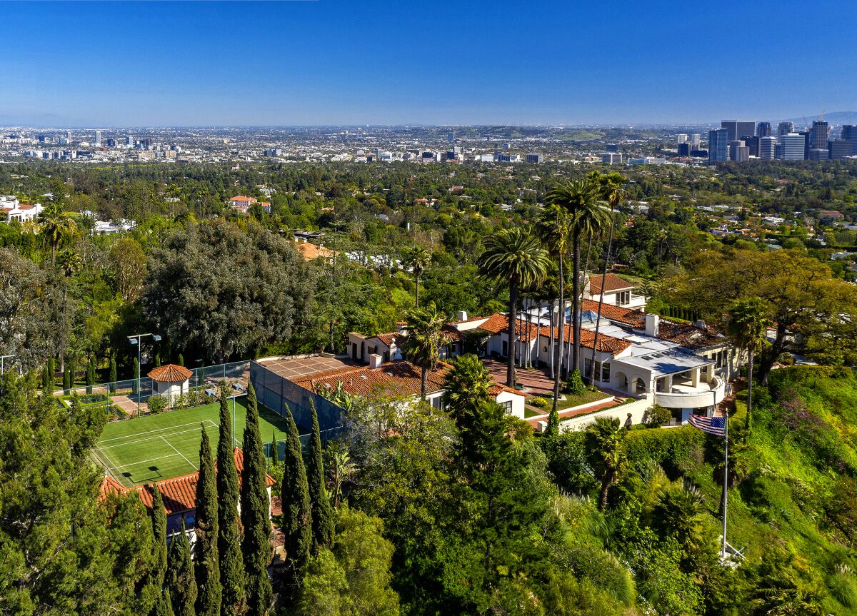 An aerial view shows LeBron James' new Beverly Hills home with the L.A. skyline in the distance.