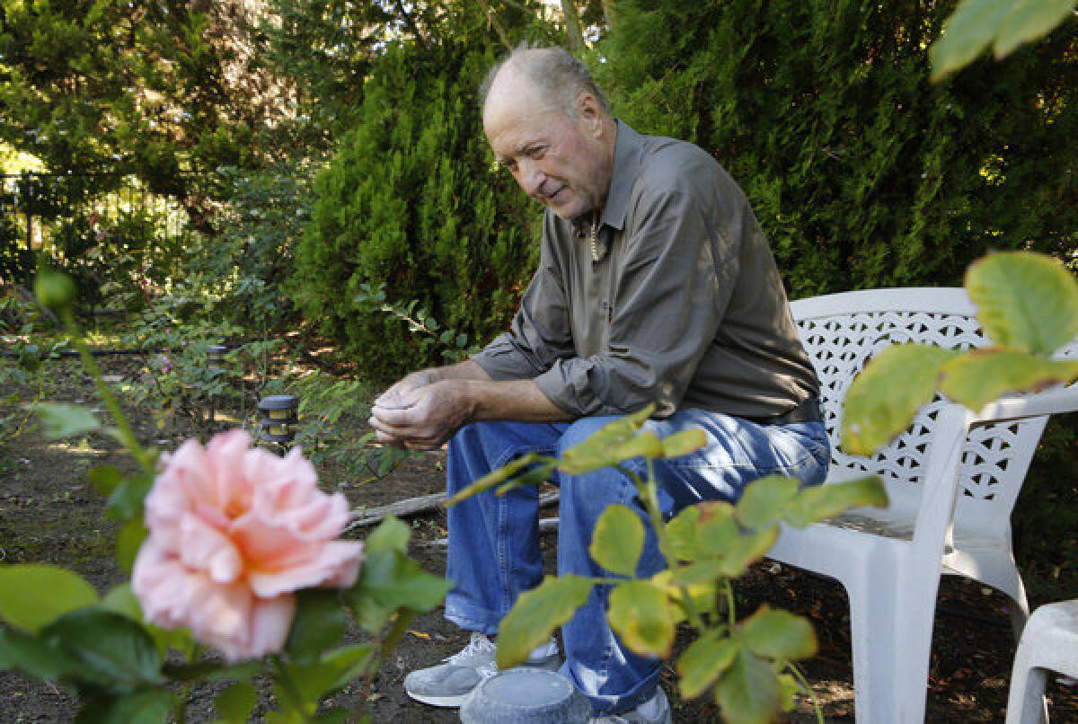 Souliotes sits in the rose garden of a house that he is helping to remodel in Escondido. The former general contractor who loved to dance was wrongfully convicted of murder after three people died in a fire at his rental house in Modesto.