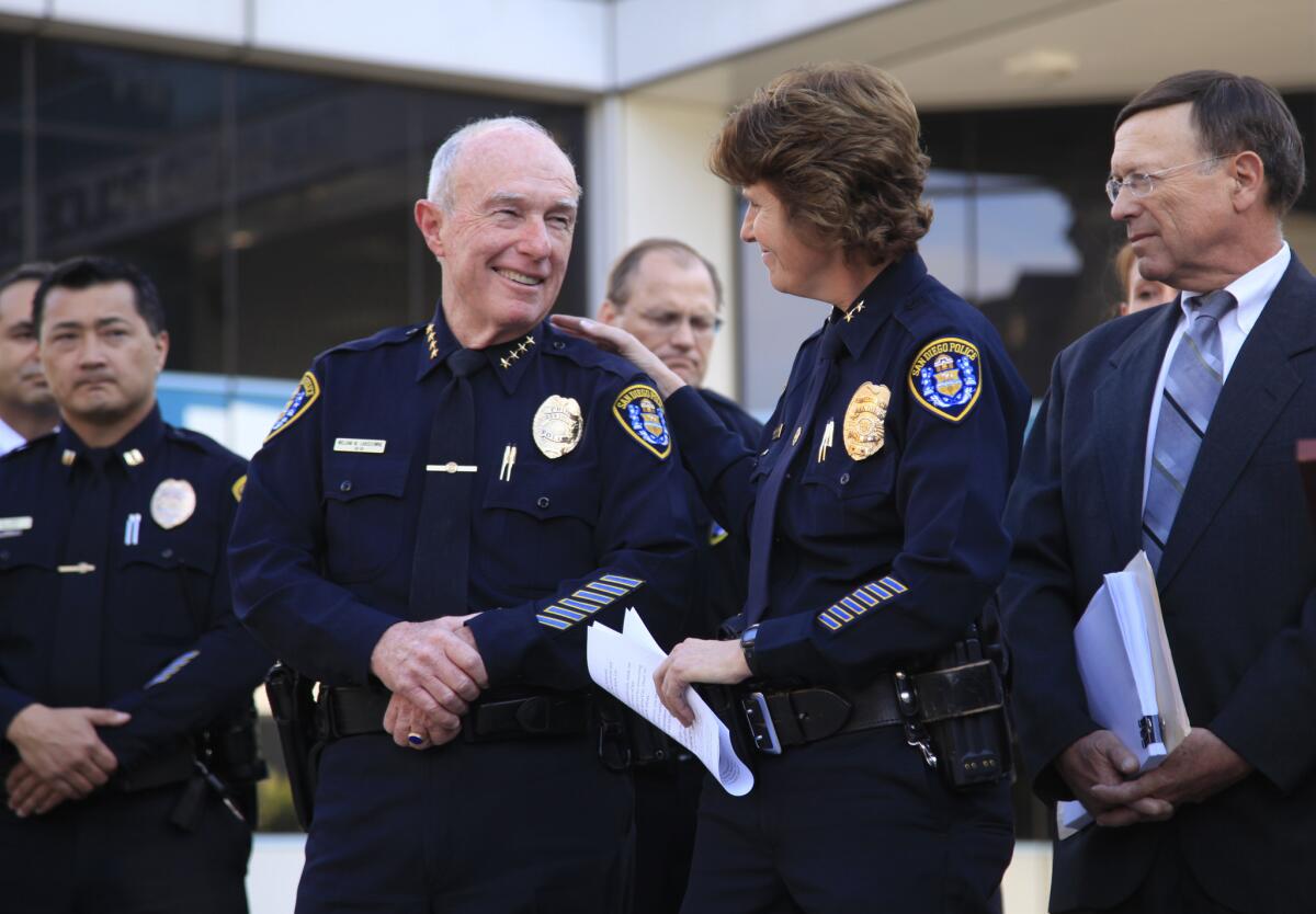 Assistant Police Chief Shelley Zimmerman, second from right, and retiring Chief William Lansdowne at police headquarters as Mayor-elect Kevin Faulconer announces that he will nominate Zimmerman as the new chief. At far right, City Atty. Jan Goldsmith.