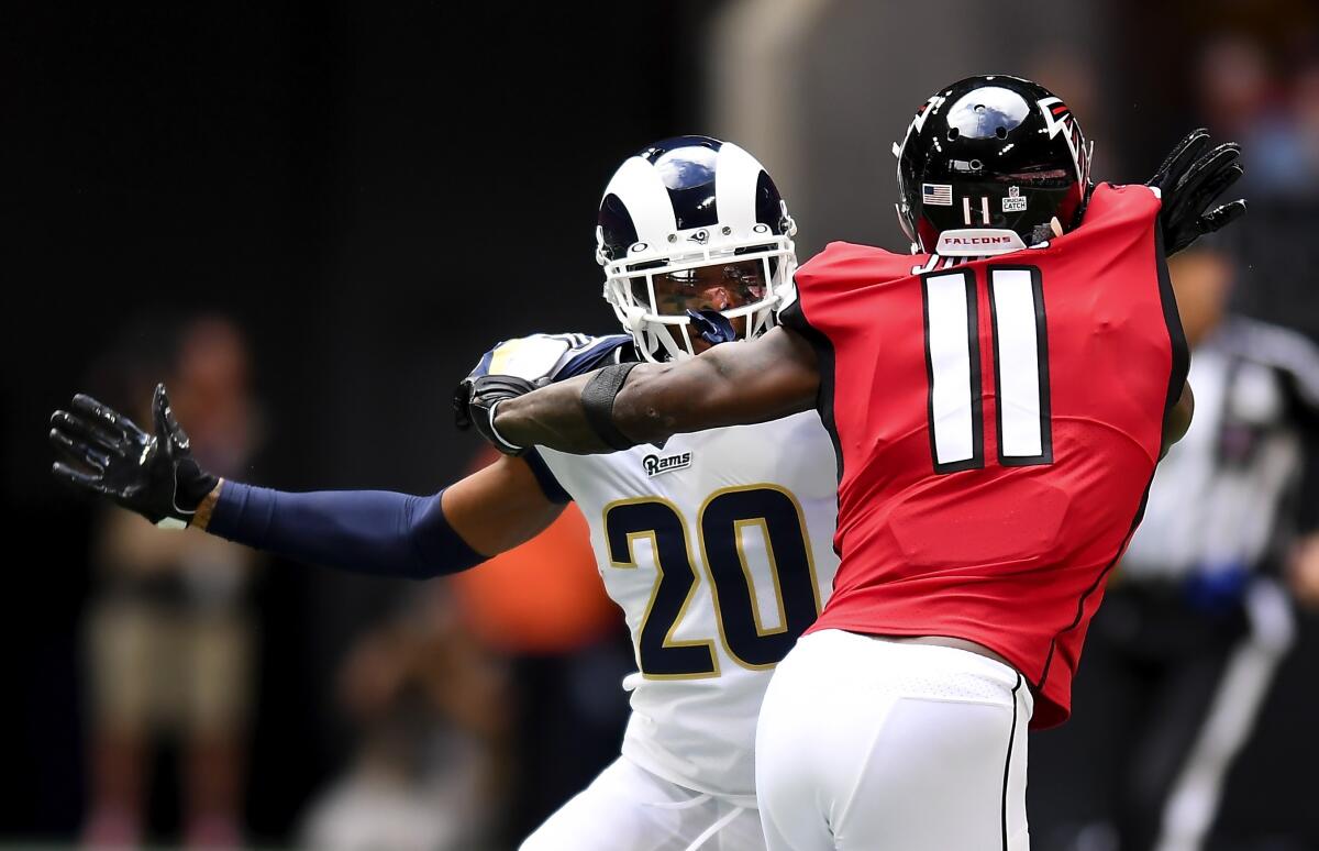 Rams cornerback Jalen Ramsey (20) defends against the Atlanta Falcons' Julio Jones.