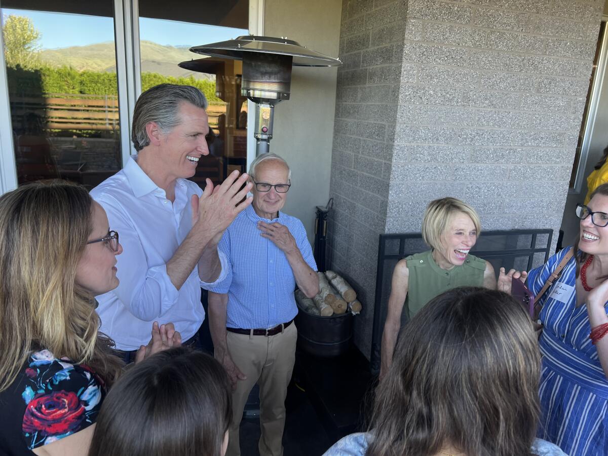 Gavin Newsom speaks with supporters at a private fundraiser in Boise, Idaho. 