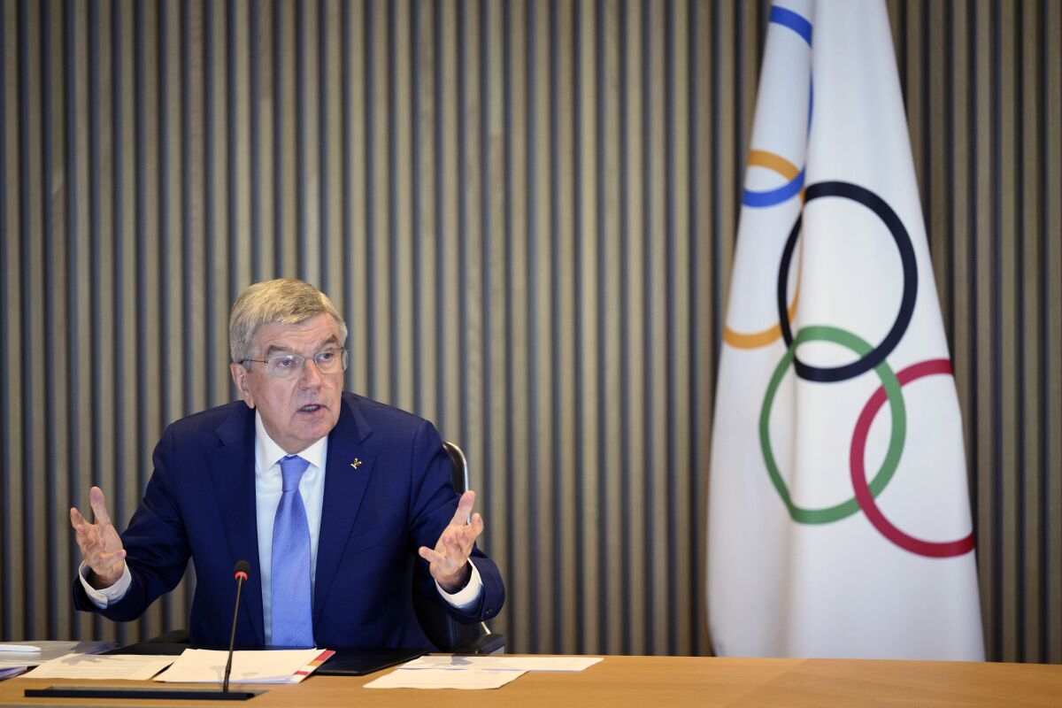 International Olympic Committee (IOC) President Thomas Bach speaks at the opening of the executive board meeting of the International Olympic Committee (IOC) in Lausanne, Switzerland, Tuesday, March 28, 2023. The IOC Executive Board is set to discuss the results of consultations regarding the status of athletes from Russia and Belarus in its meeting set to run until March 30. (Laurent Gillieron/Keystone via AP)