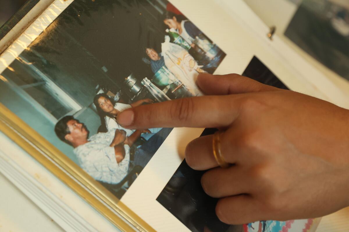 Maria Lopez shows photos of the family home when she was a child