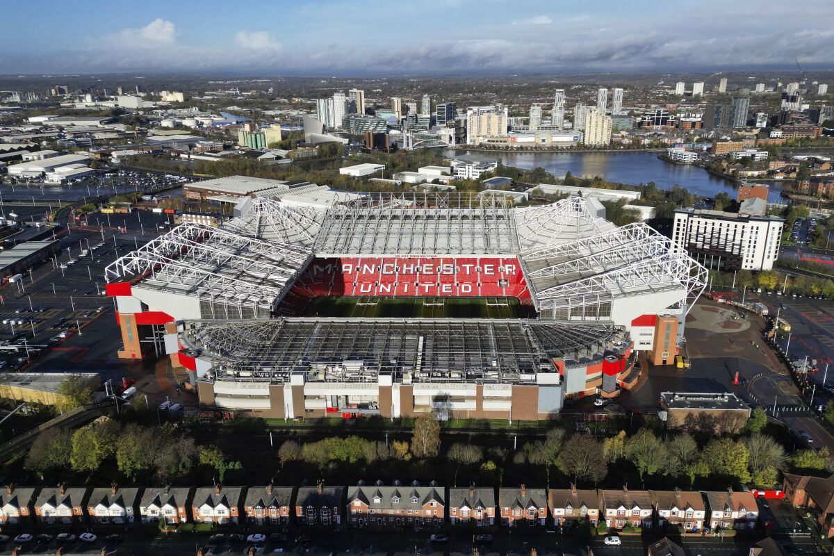 A photograph taken using a drone shows Manchester United's Old Trafford stadium after owners the Glazer family announced they are considering selling the club as they "explore strategic alternatives", Manchester, England, Wednesday, Nov. 23, 2022. On Tuesday, the same day the potential sale was annnounced it was also it was also confirmed that Cristiano Ronaldo had left Manchester United by mutual consent. (AP Photo/Jon Super)