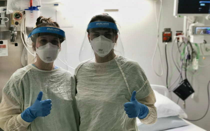 Medical workers Emilie Guimond, left, and Marie Kim Roger wear Bauer protective shields.