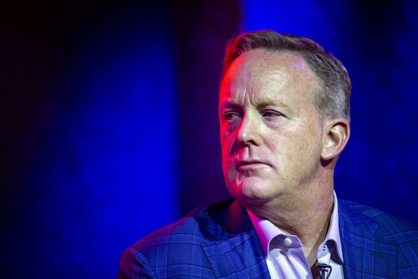 Former White House press secretary Sean Spicer is threatening legal action against a man who claims Spicer called him the N-word in high school.