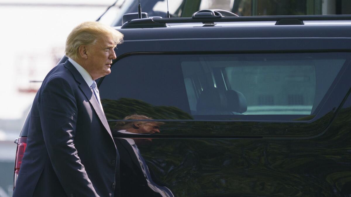 President Trump arrives at Walter Reed National Military Medical Center in Bethesda, Md., on Tuesday to visit First Lady Melania Trump.