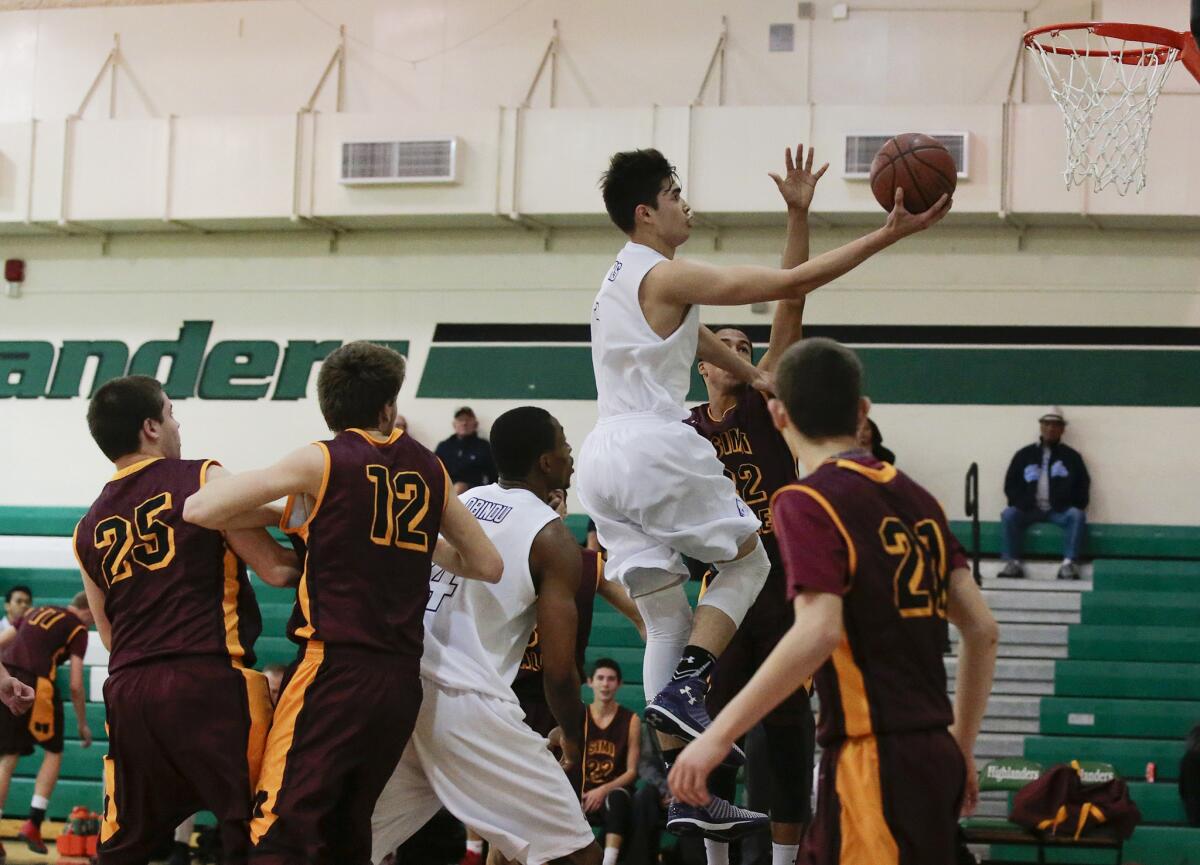 Cathedral's Kobe Paras slices to the basket for a layup against Simi Valley High during a game on Dec. 18.