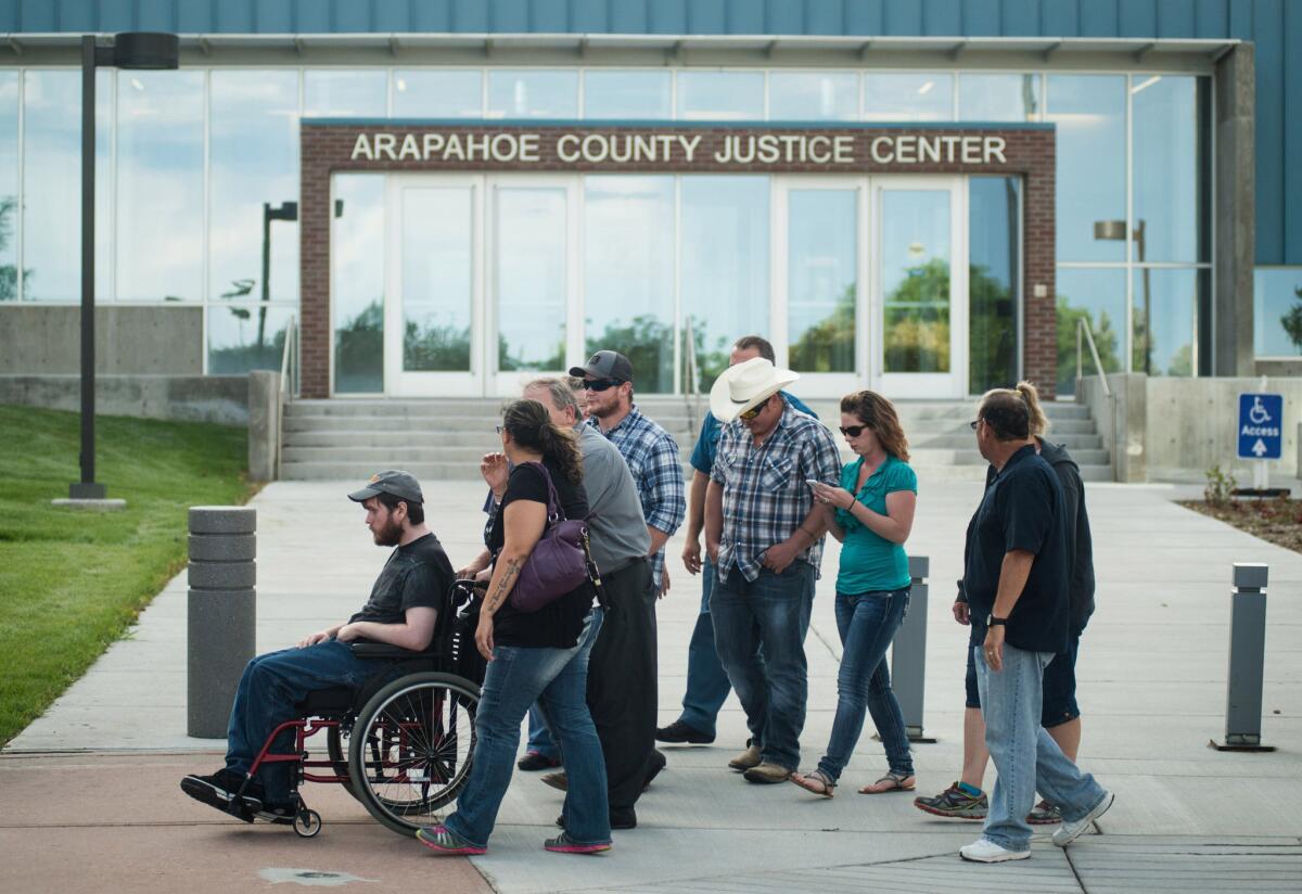Caleb Medley, a survivor of the Aurora theater massacre, leaves the Arapahoe County Justice Center after James Holmes was convicted on all 165 counts. The verdict came Thursday, nearly three years to the day after Holmes stormed the theater, killing 12 and wounding 70.