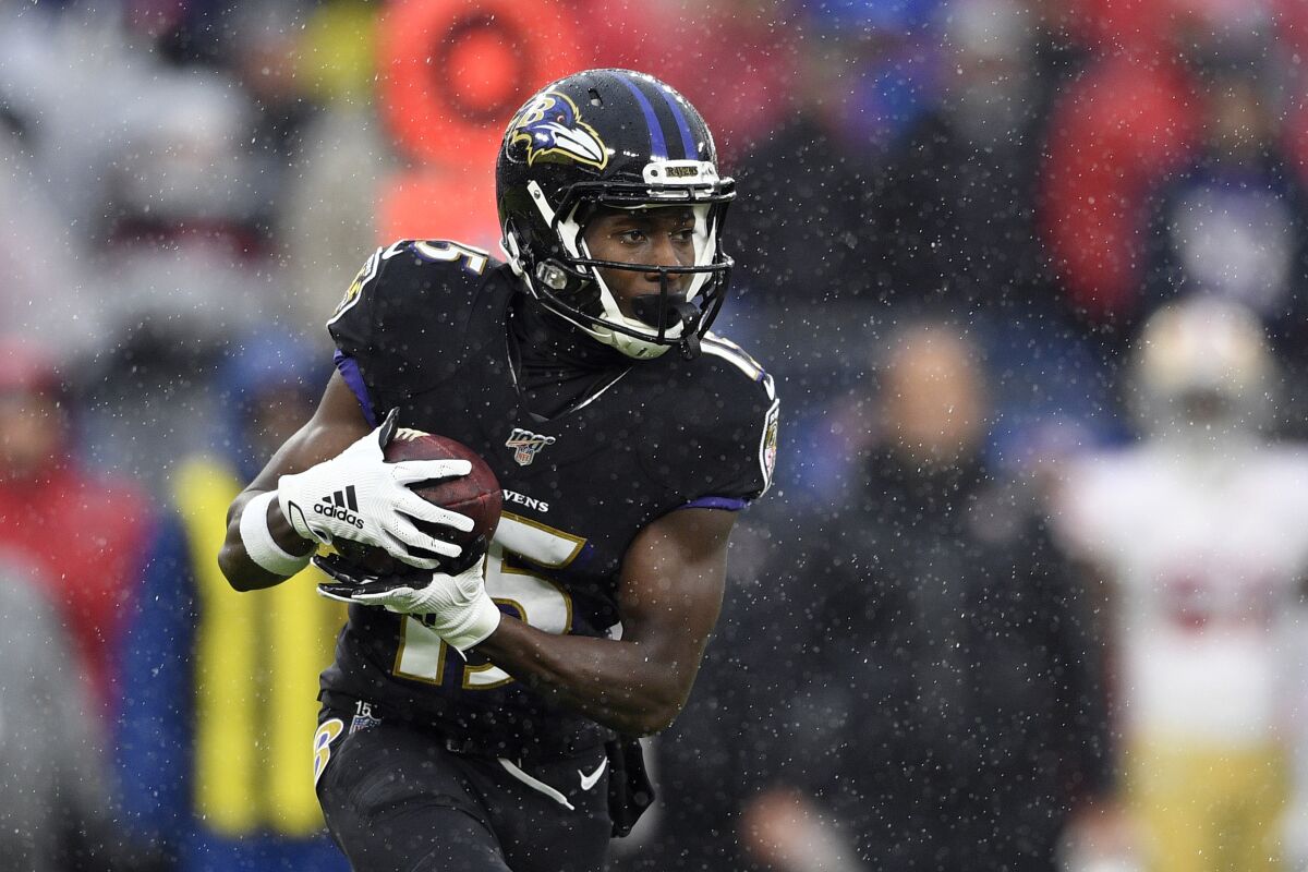 FILE - In this Dec. 1, 2019, file photo, Baltimore Ravens wide receiver Marquise Brown (15) runs with the ball during the first half of an NFL football game against the San Francisco 49ers in Baltimore, Md. Brown put up some respectable numbers as a rookie last year with the Ravens, leading the team's wide receivers in receptions and touchdowns as the primary downfield target for NFL MVP Lamar Jackson. (AP Photo/Nick Wass, File)