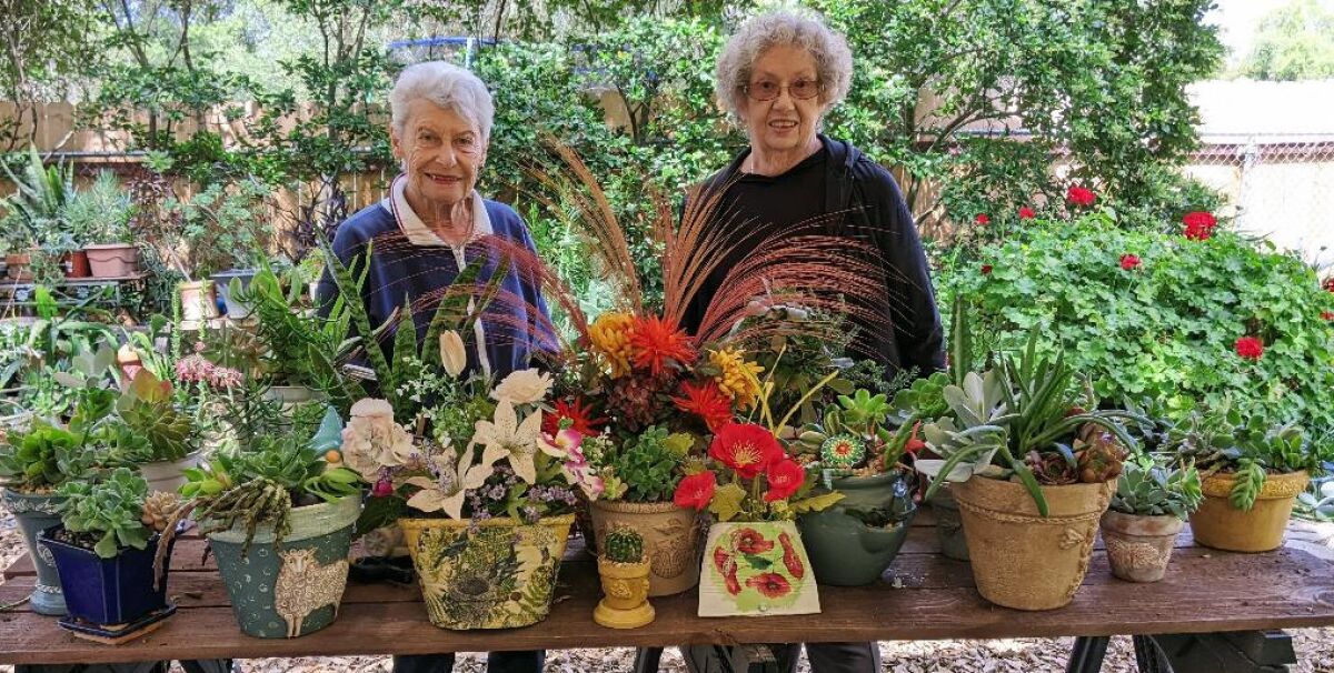 Ramona Garden Club crafters Sandy Bedard, left, and Jane Vidal prepared for one of the club’s spring Plant and Craft sales.