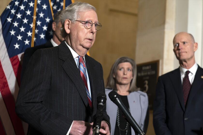 Senate Minority Leader Mitch McConnell of Ky., speaks to reporters on Capitol Hill in Washington, Tuesday, Feb. 8, 2022. (AP Photo/Mariam Zuhaib)