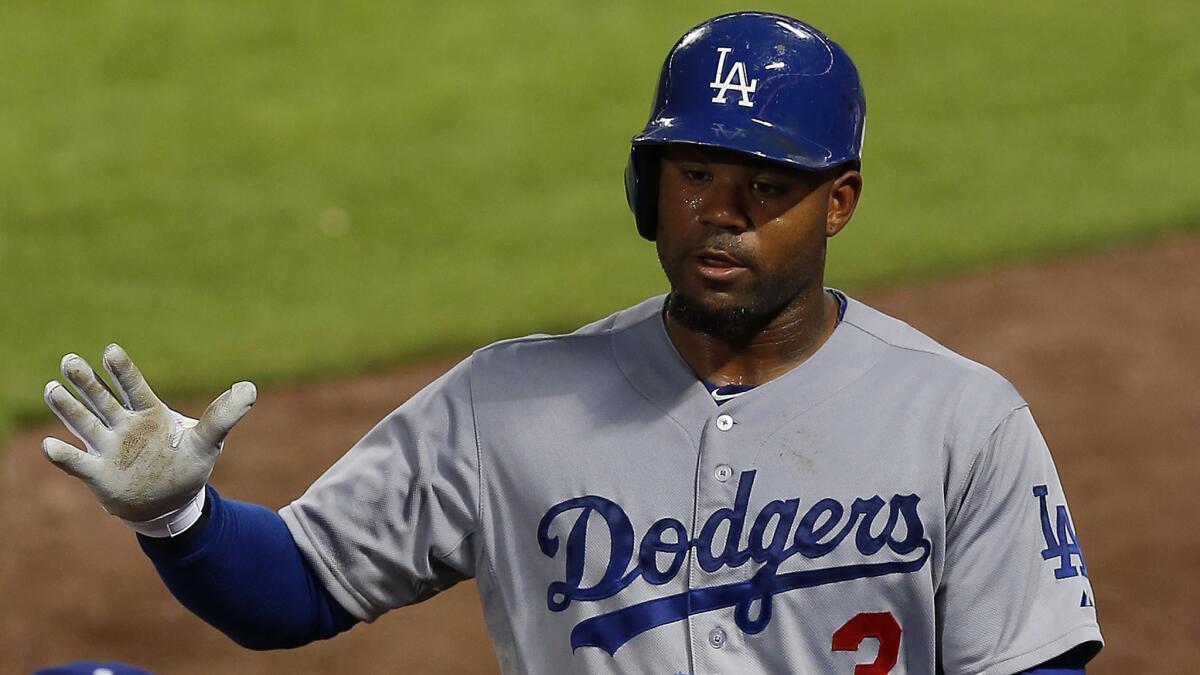 Dodgers left fielder Carl Crawford celebrates with his teammates after scoring against the Atlanta Braves on Aug. 12. Crawford played a big role in the Dodgers' 8-6 win over the San Diego Padres on Tuesday.